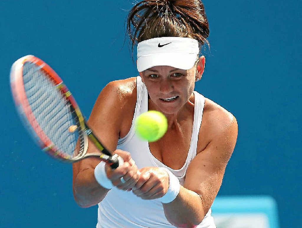 Casey Dellacqua drills a backhand return in the match against Kirsten Flipkens at the Australian Open yesterday. Casey Dellacqua drills a backhand return in the match against Kirsten Flipkens at the Australian Open yesterday.